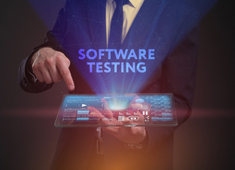 The concept of business, technology, the Internet and the network. A young entrepreneur working on a virtual screen of the future and sees the inscription: Software testing