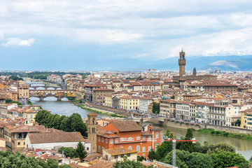 Fototapeta premium Panaromic view of Florence townscape cityscape viewed from Piazzale Michelangelo (Michelangelo Square) with ponte Vecchio and Palazzo Vecchio with lightningPanaromic view of Florence townscape citysca