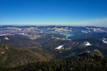 Obraz premium Aerial Landscape view from Ceahlău Mountains National Park at sunrise in winter season