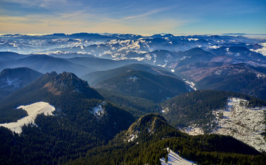 Aerial Landscape view from Ceahlău Mountains National Park at sunrise in winter season