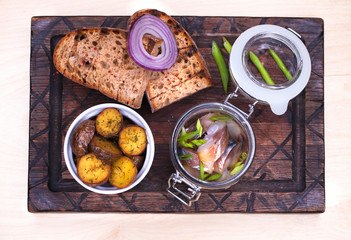 Marinated mackerel in a glass jar - snack under vodka