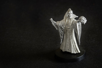 Tin figure of a magician with a crossbow.