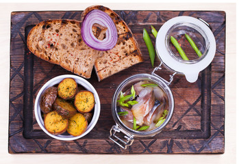 Marinated mackerel in a glass jar - snack under vodka