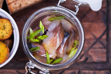 Marinated mackerel in a glass jar - snack under vodka