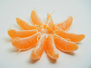 Mandarin is cleared from the skin. Fruit on white background.