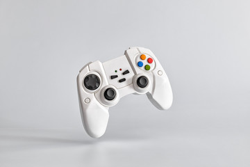 White gamepad on white uniform background. Copy space for text © Павел Абрамов