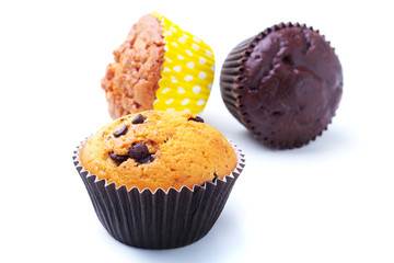 Cupcake, muffin with raisins and chocolate isolated on white background. Delicious homemade Muffins. Top view.