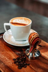 cup of coffee on wooden table