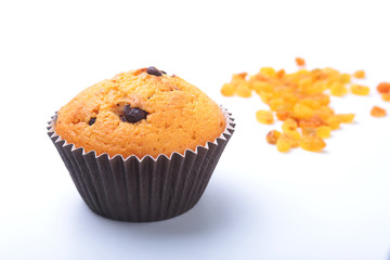 Cupcake, muffin with raisins and chocolate isolated on white background. Delicious homemade Muffins. Top view.