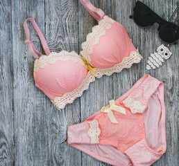 Cotton rose panties and bra. Top view shot of fashionable women's underwear. Natural soft fabric