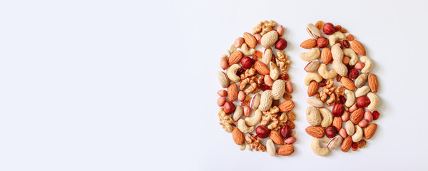 Hazelnuts, cashews, peanuts, walnuts, almonds in the shape of the brain