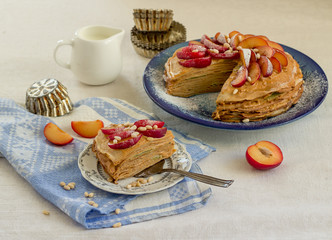 Pancake pie with caramel cream and fruit