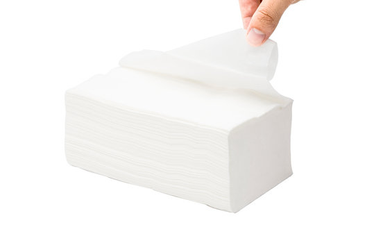Female hand pulling white paper napkin  on white background. Isolated and clipping path.- Image
