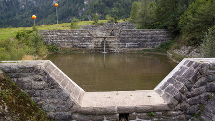 canal of water barriers small pond on alps