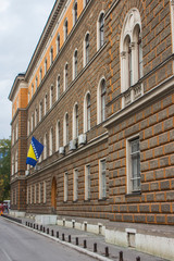 Historic house with a flag on the facade in the center of Sarajevo. Bosnia and Herzegovina