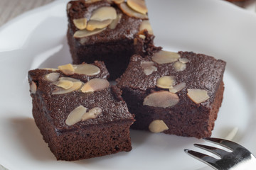 close up of delicious chocolate brownie cake in white plate