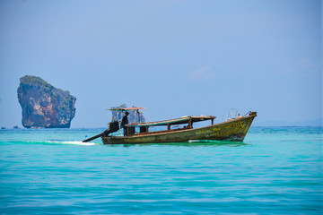 Thai wooden boat on the coast of the Andaman Sea.