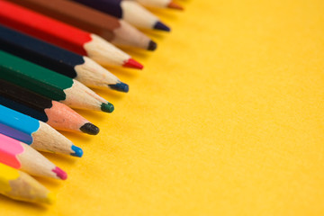Pencils On The Yellow Background. Copy Space