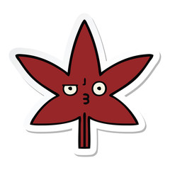 sticker of a cute cartoon autumnal leaf