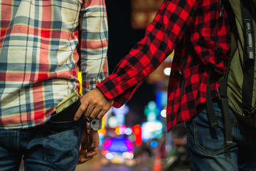 Man who stole the Backpacker tourist cash. Hand that stealing money from the back pocket of the...