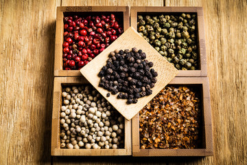 spices for a tasty meal on an old wooden table