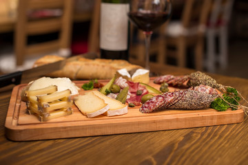 Cheese, sausages and red wine as an appetizer
