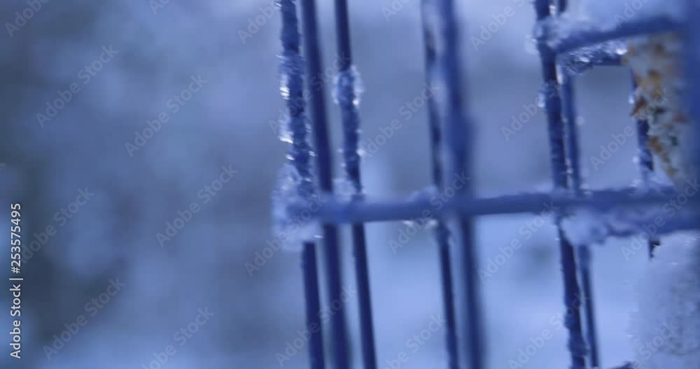 Aufkleber a slow motion shallow depth of field shot of a bird feeder in the snow.
