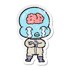 distressed sticker of a cartoon big brain alien crying