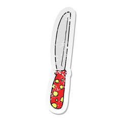 distressed sticker of a cartoon knife
