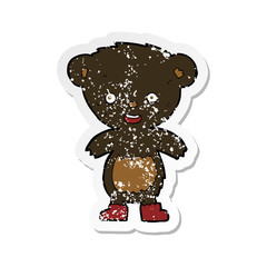 retro distressed sticker of a cartoon black bear cub