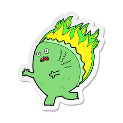 sticker of a cartoon monster on fire