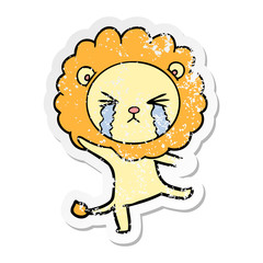 distressed sticker of a cartoon crying lion