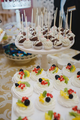 Candy bar with sweets and cakes. Background texture