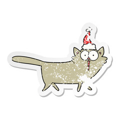 distressed sticker cartoon of a cat wearing santa hat