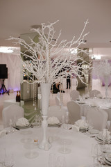 Finely decorated restaurant with white and silver elements.