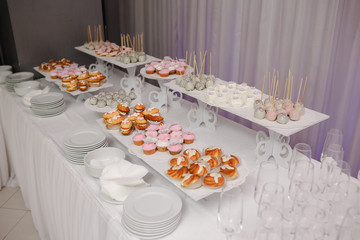 Candy bar with sweets and cakes. Background texture