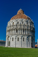 Pisa Baptistery Battistero di Pisa on Piazza del Miracoli Duomo square,Camposanto cemetery, leaning tower of pisa in Tuscany, Italy
