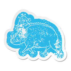 cartoon distressed sticker of a wild boar wearing santa hat