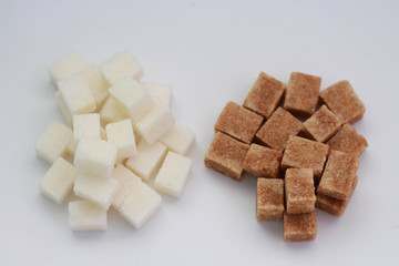 brown and yellow sugar lumps close up