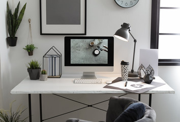 Stylish workplace with modern computer on desk
