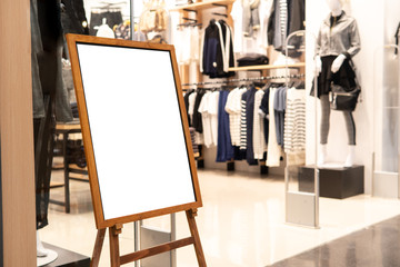 Blank promotion poster display stand at clothes shop or storefront.Promotion information for announcement message successful marketing.
