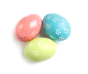 Beautiful painted Easter eggs on white background, top view