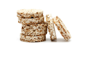 Crispy crispbread with buckwheat, rice and oatmeal isolated on white background. Crisp dietary fitness bread. Food for weight loss.