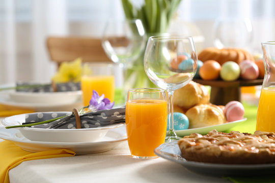 Festive Easter table setting with traditional meal at home, space for text