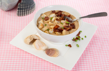 Seafood Chowder Sprinkled with Bacon Chips and Decorated with Sea Shells.