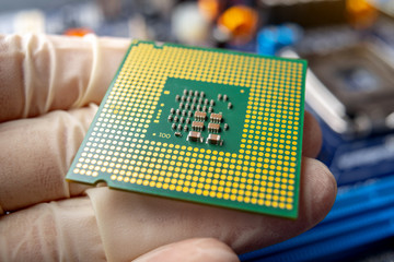 Chip microprocessor in the hands of an engineer technician for the computers. High technology and...
