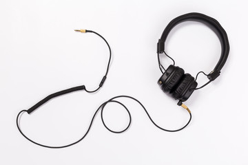Black headphones on white background