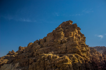 lonely rocky steep mountain object in Middle East country desert environment