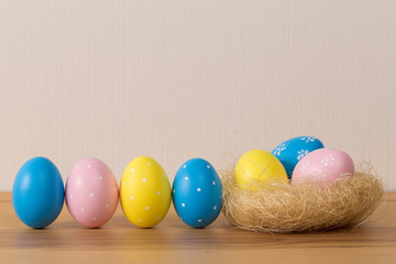 Easter eggs with colored eggs in nest