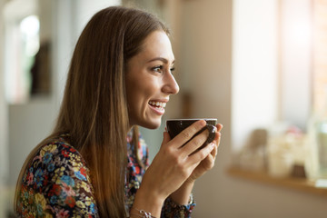 Young woman with cup of coffee